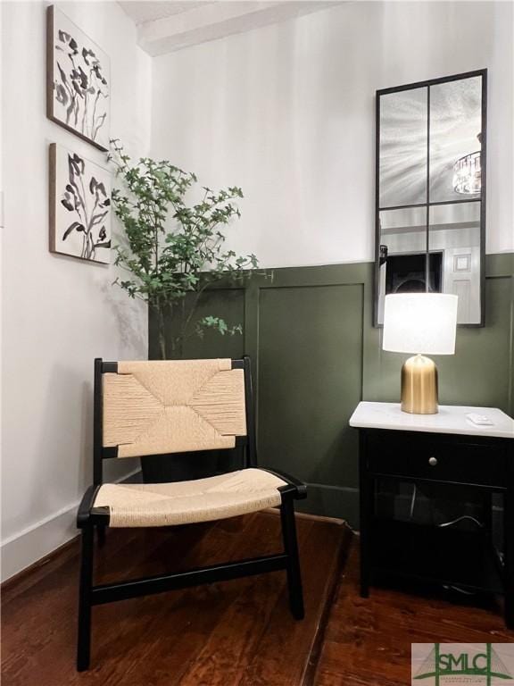 sitting room with dark hardwood / wood-style flooring