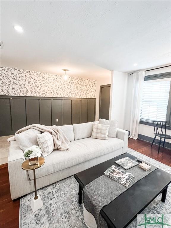 living room with dark hardwood / wood-style flooring