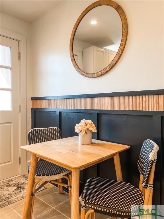 dining space with tile patterned flooring