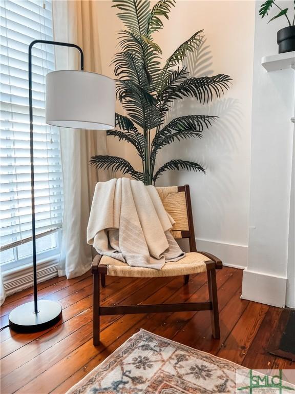 sitting room with hardwood / wood-style flooring