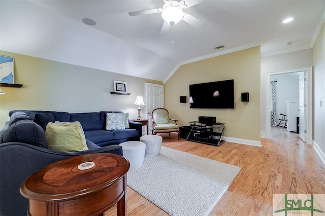 living room featuring ornamental molding, vaulted ceiling, light hardwood / wood-style floors, and ceiling fan