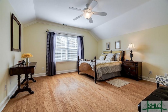 bedroom with lofted ceiling, light hardwood / wood-style flooring, and ceiling fan