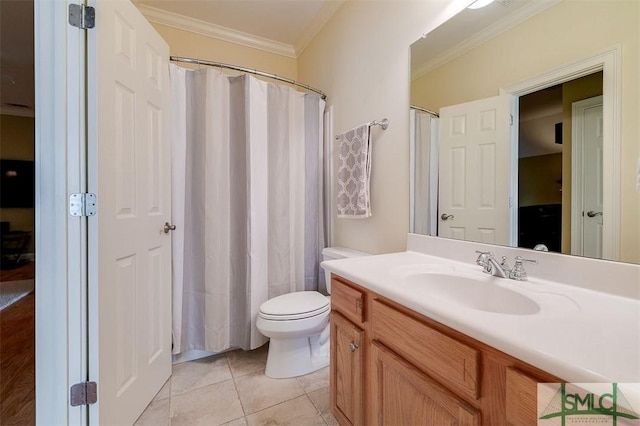 bathroom featuring vanity, crown molding, tile patterned floors, and toilet