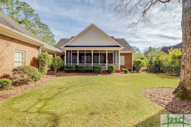 back of property featuring a lawn