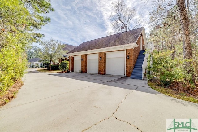 view of side of property with a garage