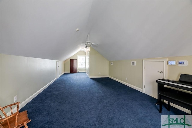 bonus room with dark colored carpet, vaulted ceiling, and ceiling fan