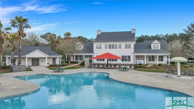 view of swimming pool featuring a patio area