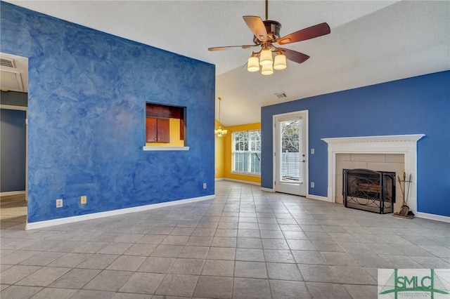 unfurnished living room with tile patterned flooring, a tile fireplace, ceiling fan, and lofted ceiling