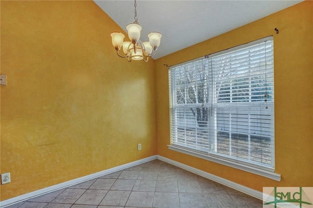 empty room featuring a notable chandelier and a healthy amount of sunlight