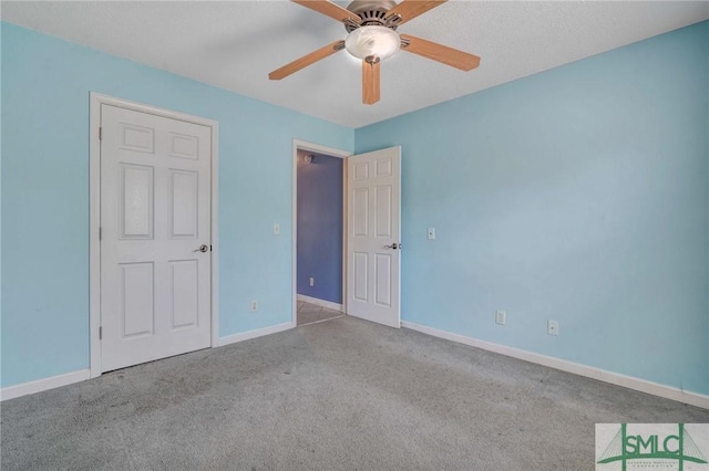 unfurnished bedroom with light carpet and ceiling fan