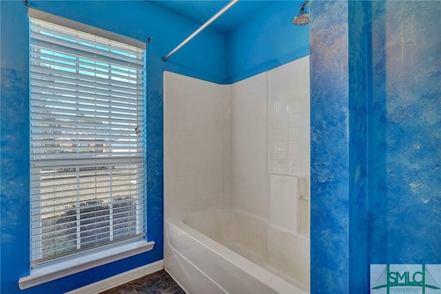 bathroom with shower / washtub combination