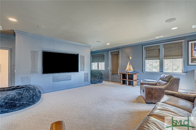 carpeted living room featuring ornamental molding