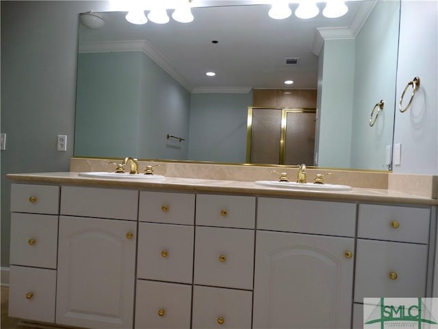 bathroom with crown molding, vanity, and a shower with shower door