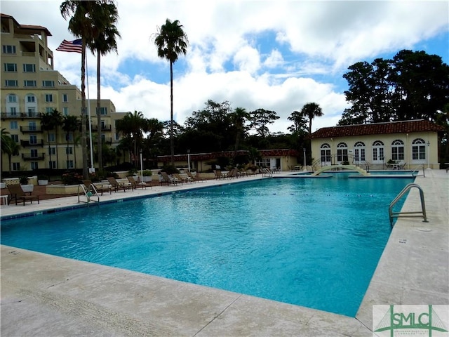 view of swimming pool featuring a patio