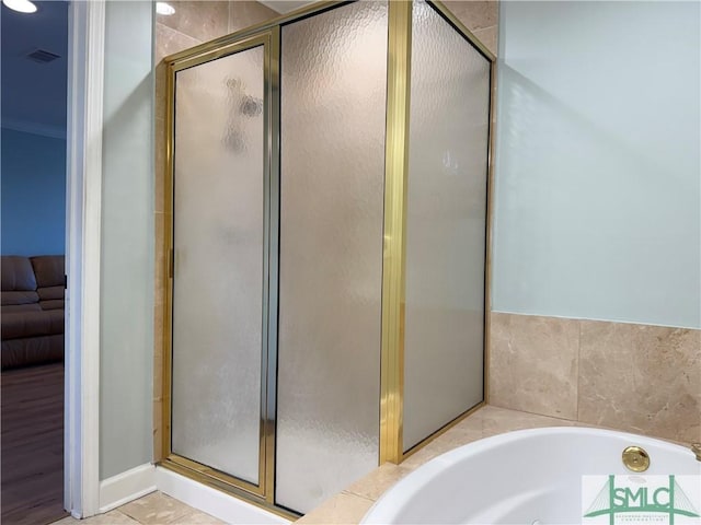 bathroom featuring tile patterned flooring and plus walk in shower