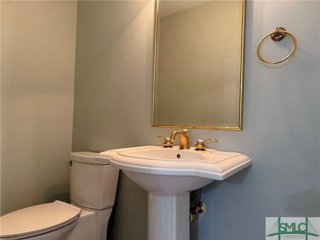 bathroom featuring toilet