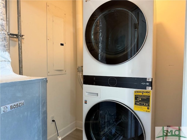 laundry room with stacked washer and dryer