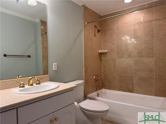 full bathroom with ornamental molding, toilet, tiled shower / bath combo, and vanity