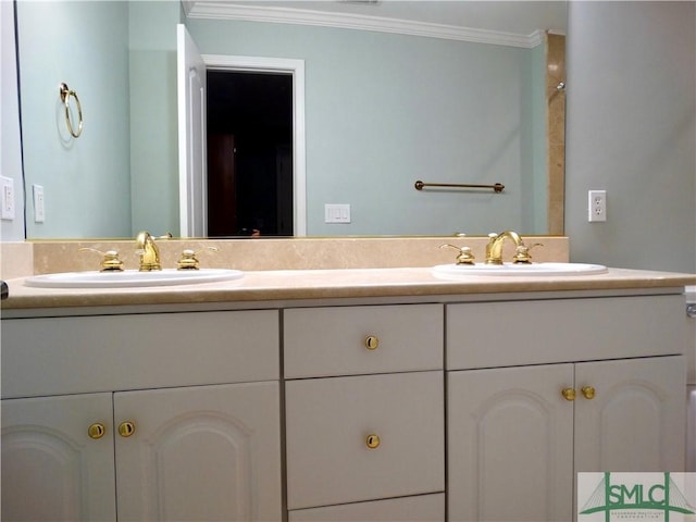 bathroom featuring crown molding and vanity