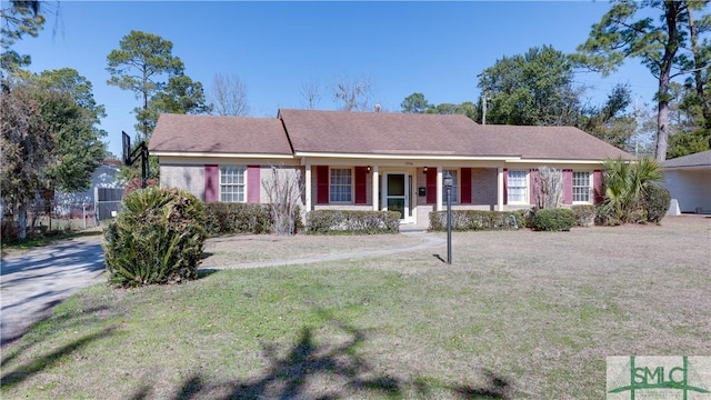 ranch-style home with a front yard