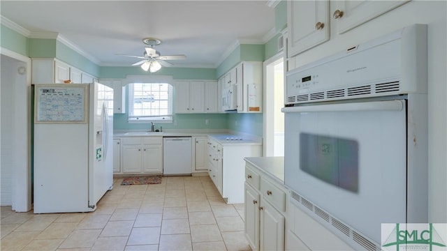 kitchen featuring white cabinetry, sink, ceiling fan, crown molding, and white appliances