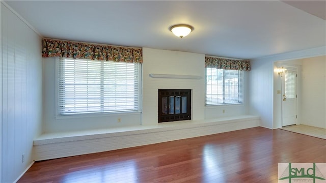 unfurnished living room featuring hardwood / wood-style floors