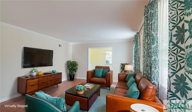 living room featuring crown molding and wood-type flooring