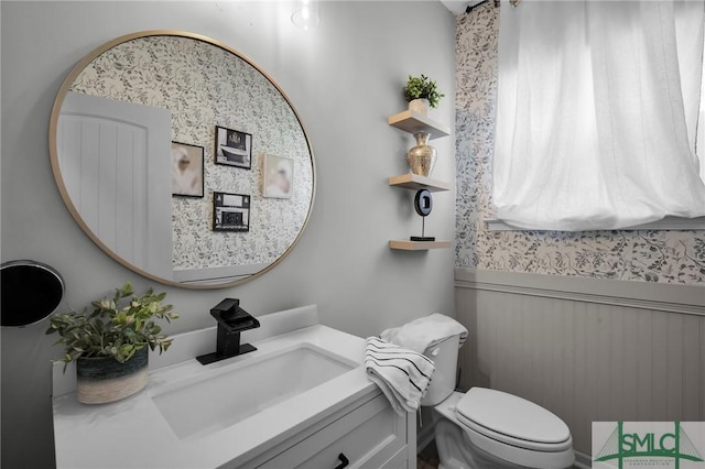 bathroom with vanity and toilet