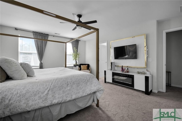 bedroom featuring ceiling fan and light colored carpet