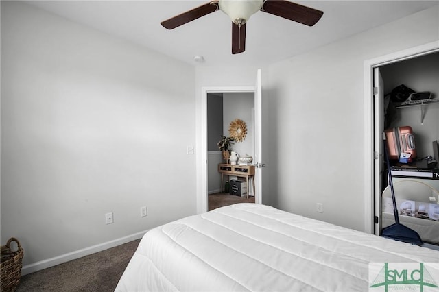 carpeted bedroom featuring ceiling fan and a closet