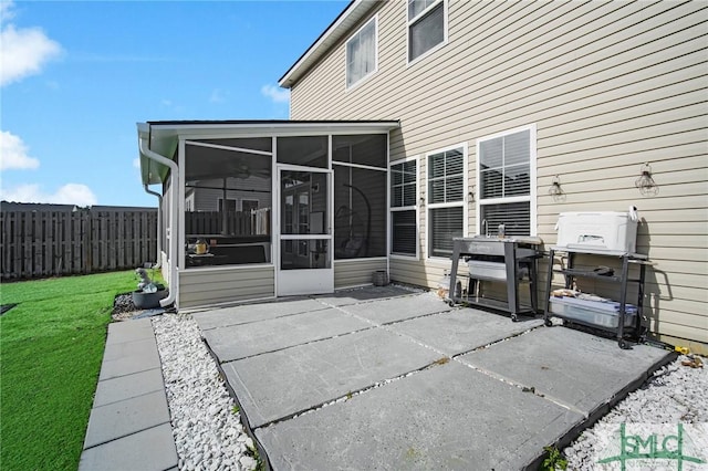 view of patio with a sunroom