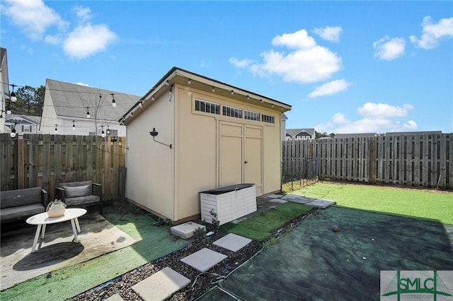 view of outbuilding with a lawn