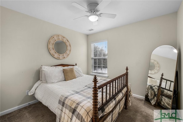 bedroom with ceiling fan and dark carpet