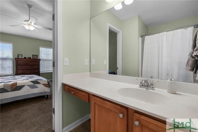 bathroom featuring ceiling fan and vanity