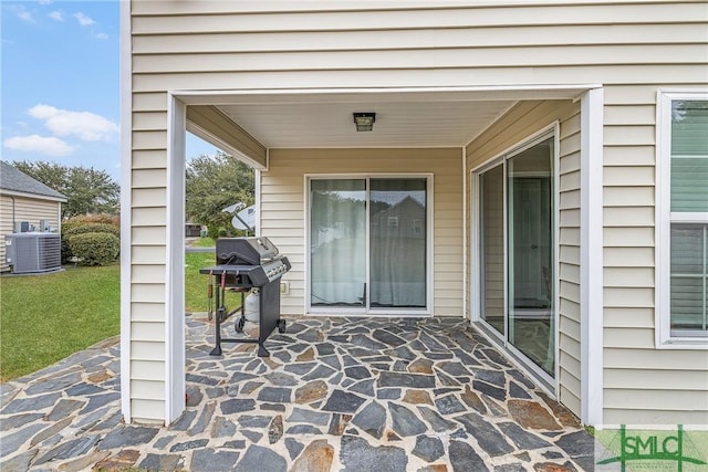 view of patio / terrace with area for grilling and cooling unit