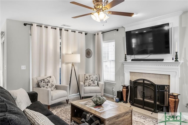 living room with a fireplace and ceiling fan