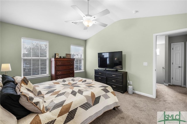 bedroom featuring light carpet, vaulted ceiling, and ceiling fan