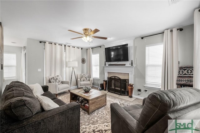 living room featuring a wealth of natural light and ceiling fan