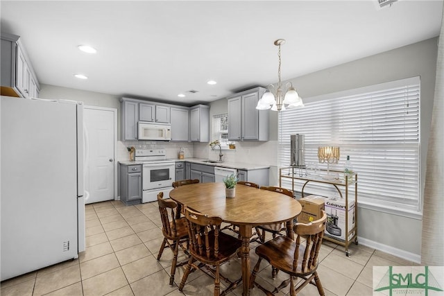 interior space with an inviting chandelier and sink