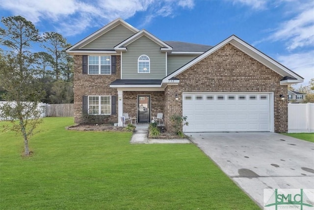 view of front of home featuring a garage and a front yard