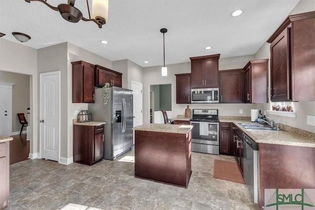 kitchen featuring sink, a center island, dark brown cabinets, pendant lighting, and stainless steel appliances