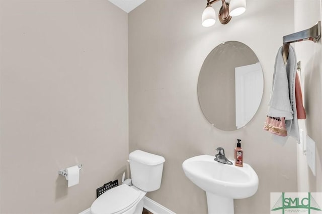 bathroom with sink and toilet