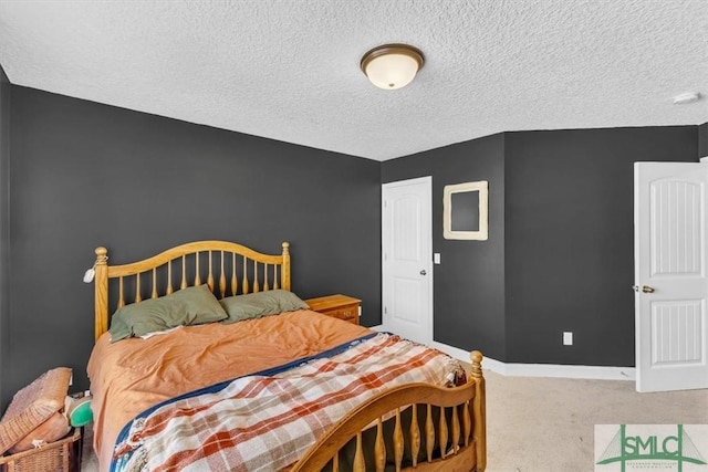 carpeted bedroom featuring a textured ceiling