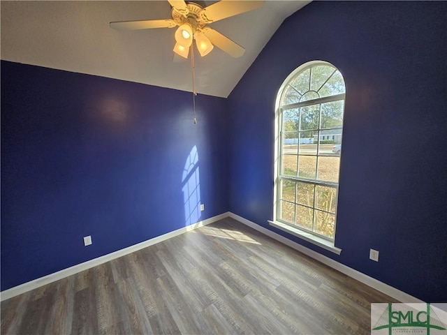 unfurnished room with wood-type flooring, lofted ceiling, and ceiling fan