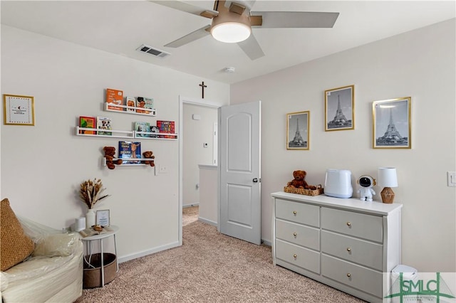 sitting room featuring ceiling fan and light colored carpet