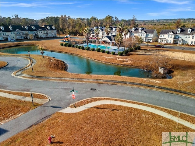 view of home's community with a water view