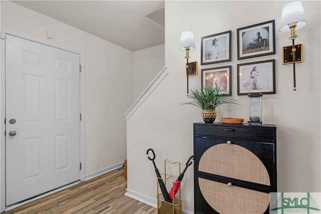 foyer entrance featuring hardwood / wood-style floors