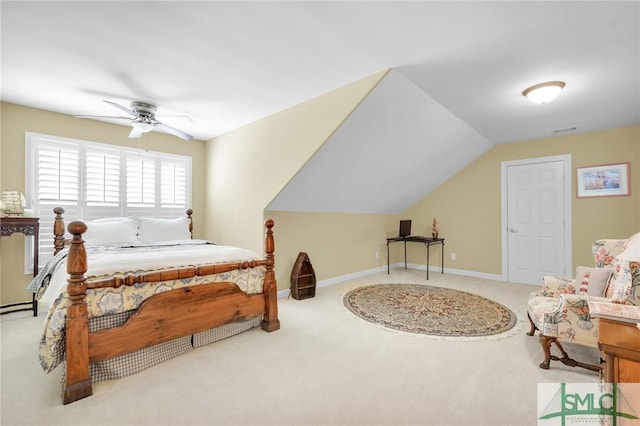 bedroom featuring light carpet and lofted ceiling