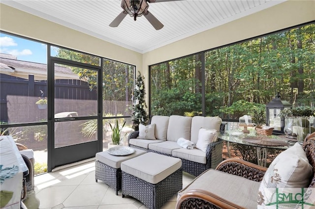 sunroom featuring ceiling fan