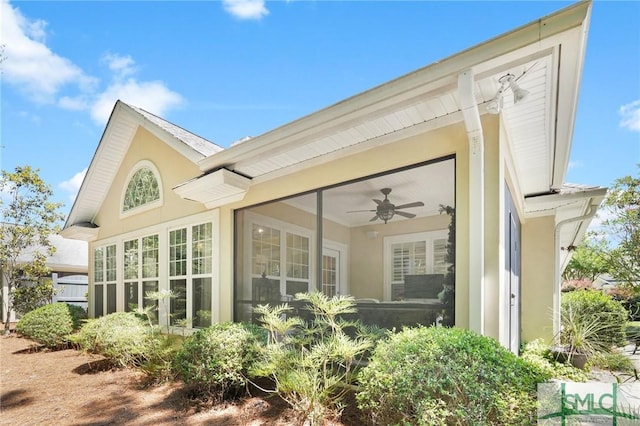 view of property exterior featuring ceiling fan